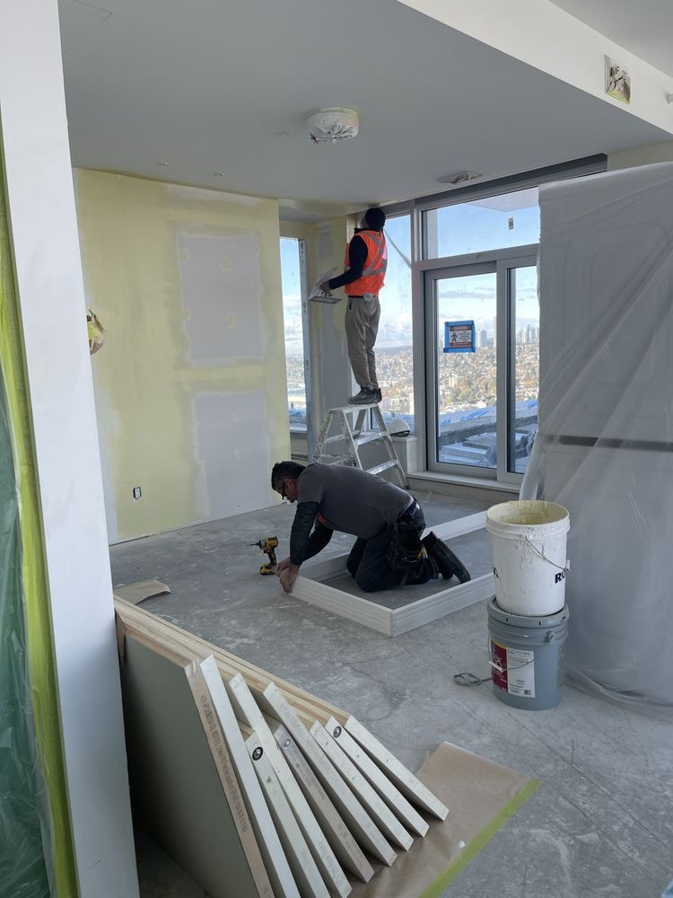 Call Top Shine Painting Ltd. for painting in Surrey, BC Top Shine Painting Ltd. interior painting crew on a job in Surrey, British Columbia